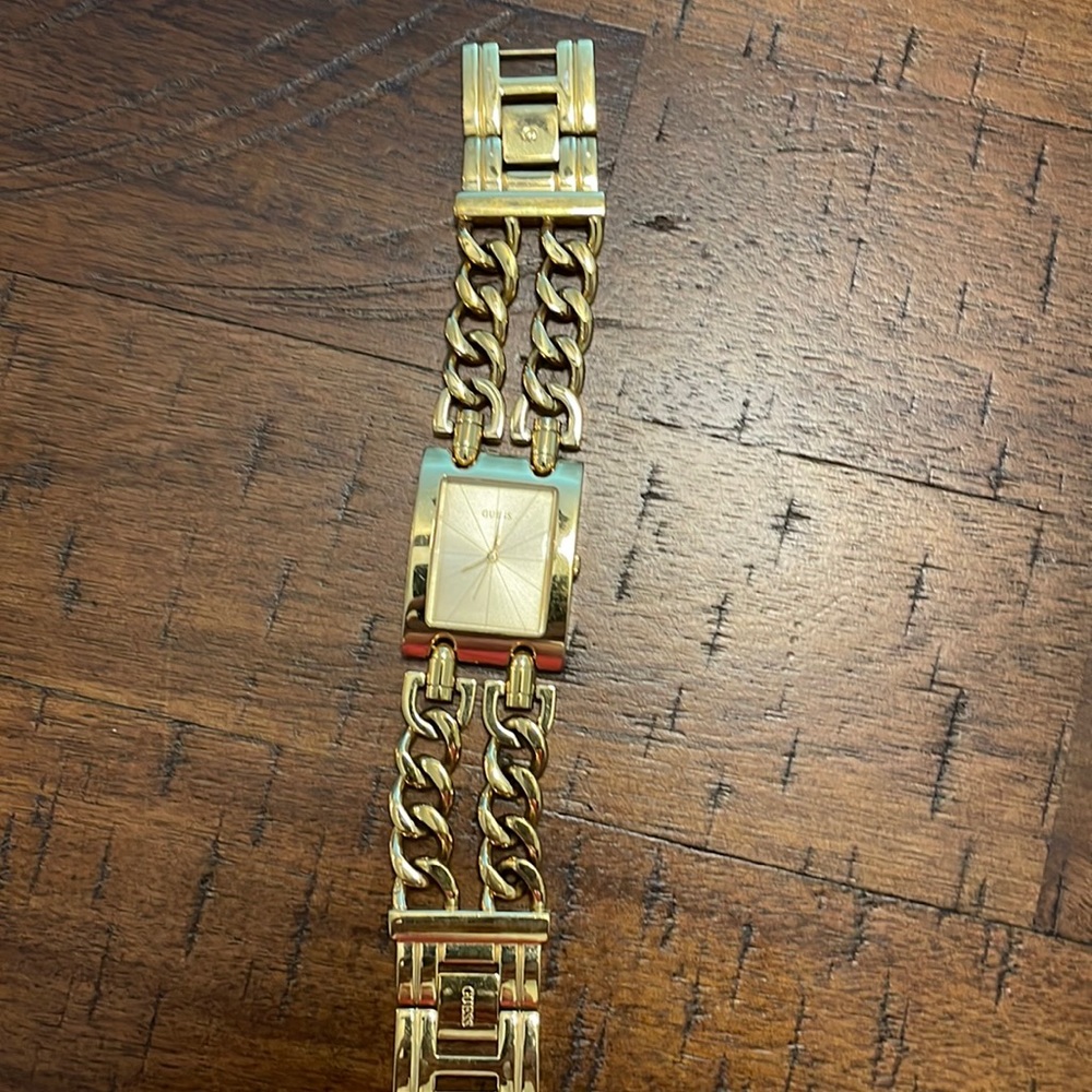 Guess watch , works well just needs new battery .